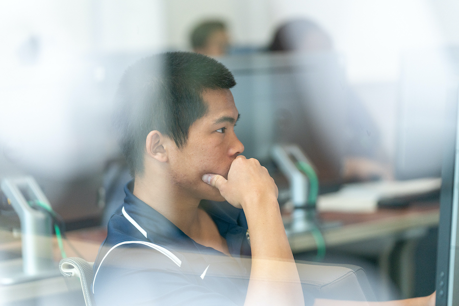 Student in School of Business classroom
