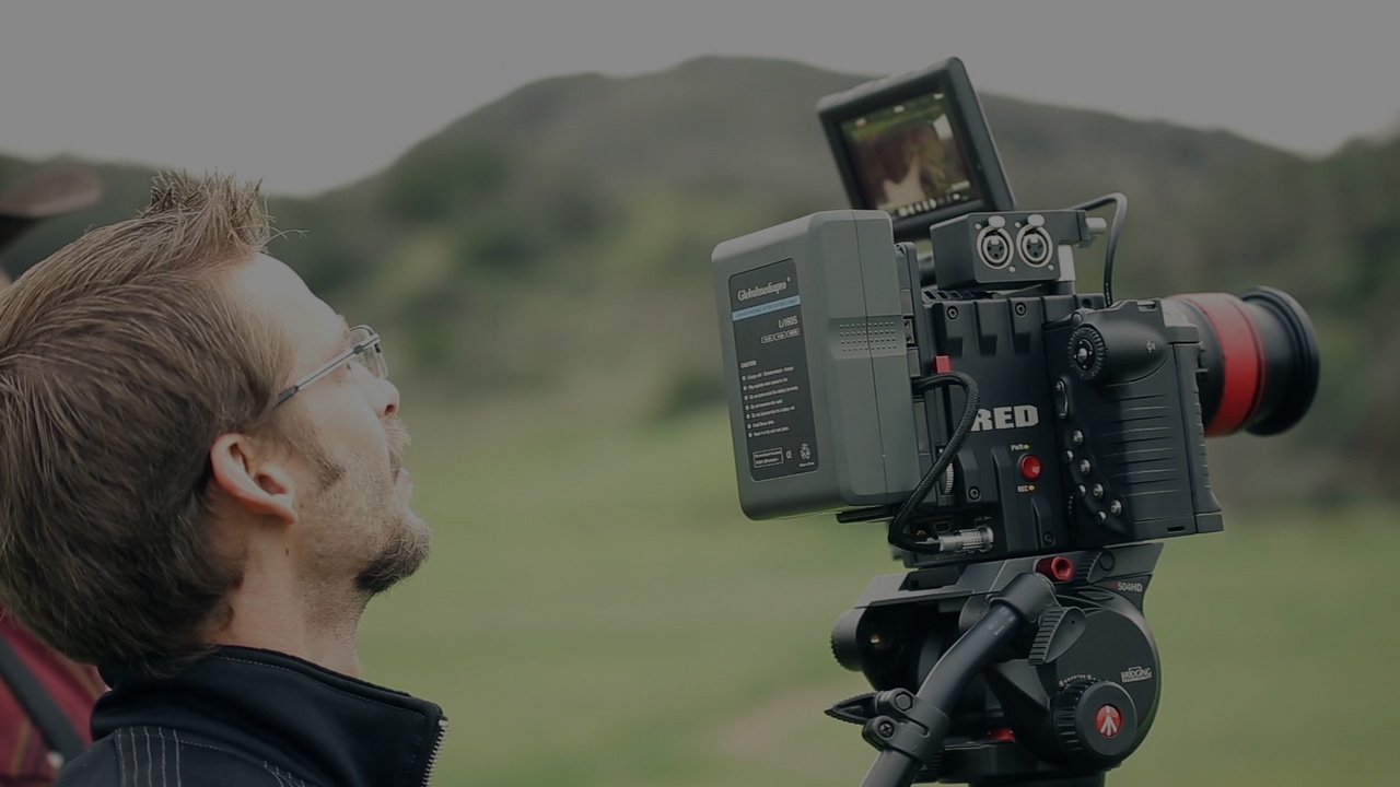 Students filming a mountain side