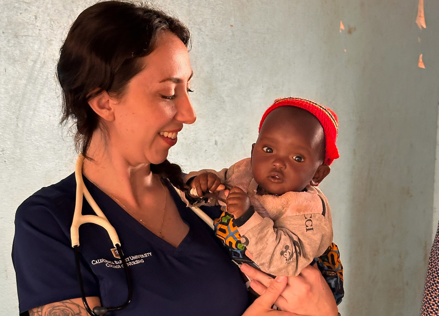 CBU Student holding baby