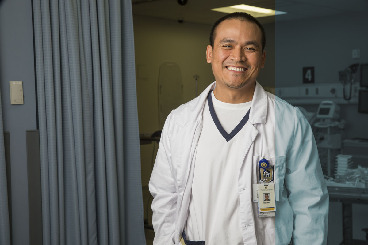 Student smiling in lab classroom