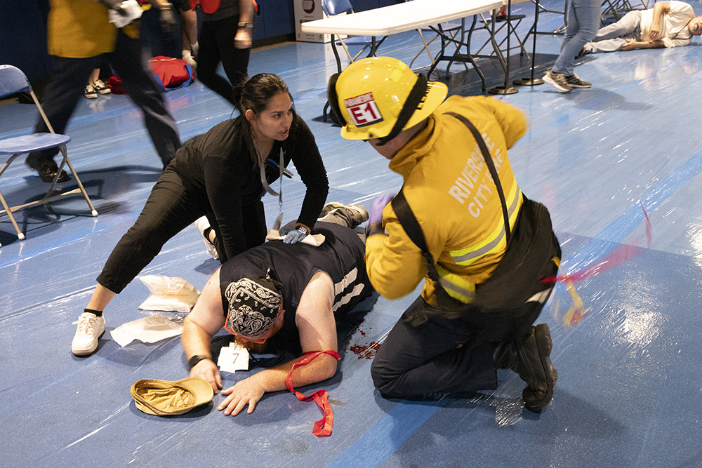 students helping someone in distress