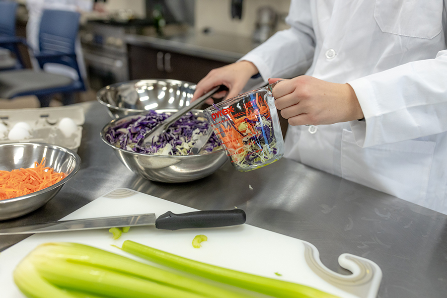 student preparing food