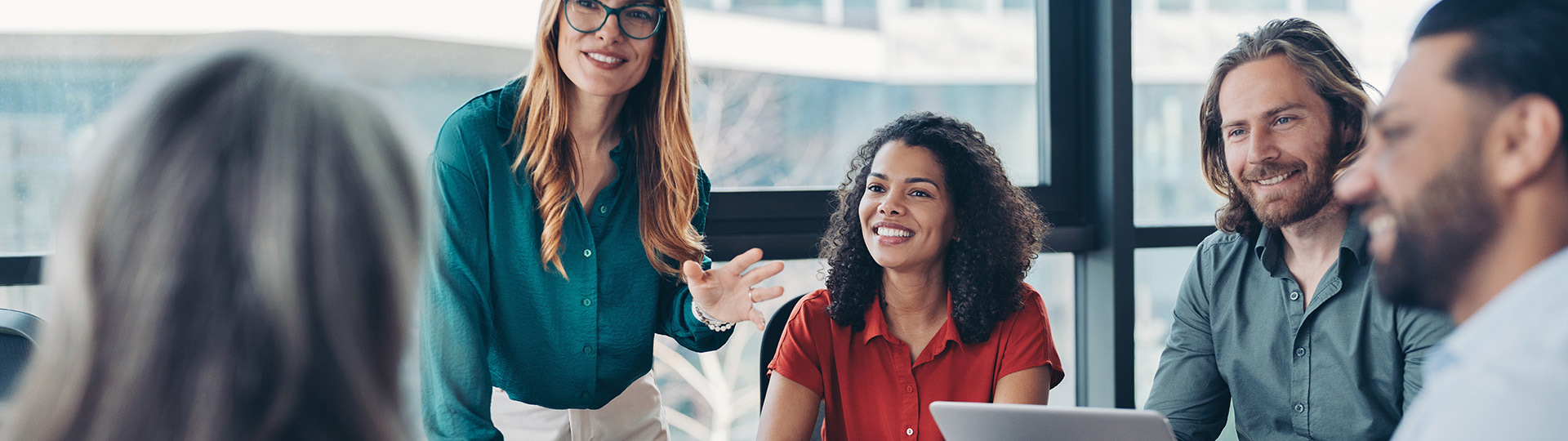 Woman giving presentation at meeting
