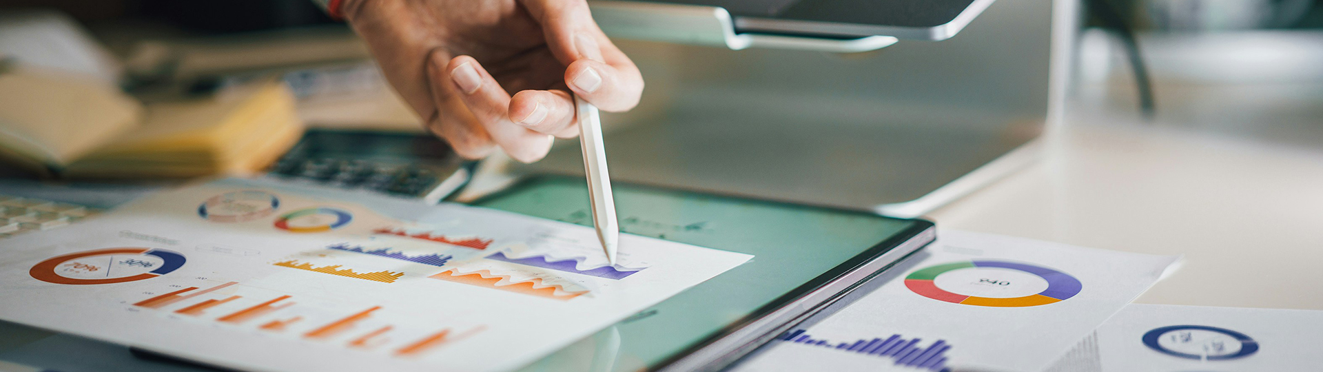 Person pointing at analytics charts