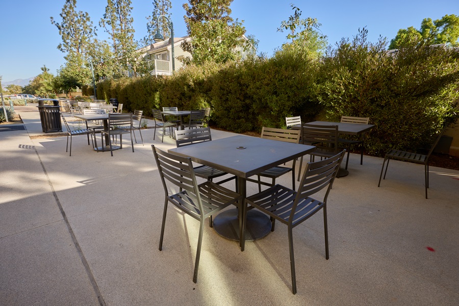Tables outside Magnolia Crossing next to BBQ kitchen